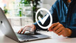 © Forida - Person interacting with a digital interface, completing online forms and data validation, with a prominent checkmark icon indicating successful task accomplishment and secure approval
