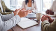 © Pamela - Close-up of diverse business colleagues actively discussing and gesturing during a productive corporate team meeting.