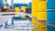© Nataliya - Industrial scene with oil spills on a concrete floor and barrels in the background, hazardous material storage and environmental risk concept, defocused background, with copy space