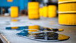 © Nataliya - Industrial scene with oil spills on a concrete floor and barrels in the background, hazardous material storage and environmental risk concept, defocused background, with copy space
