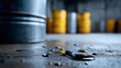 © Nataliya - Industrial scene with oil spills on a concrete floor and barrels in the background, hazardous material storage and environmental risk concept, defocused background, with copy space