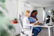 © Marko - Group of medical staff working together in a clinic during the daytime