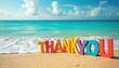 © Viktor - Colorful letters spell THANK YOU on sandy beach by turquoise ocean waves. A bright, cheerful message set against a beautiful summer seaside landscape.