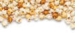 © NAHID - A pile of caramel and butter popcorn kernels on a white surface for snacking or movie night