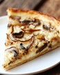 © Asna - Close up of deep dish pizza slice with mushroom topping