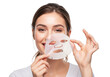 © Sultana Jahan GFX - Young Woman Applying a Sheet Mask for Radiant Skin Care Routine and Facial Beauty Treatment