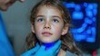 © BlackLion - Girl receives medical checkup with blue device in clinic during daytime