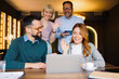 © djile - Business team waving during online video call meeting