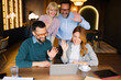 © djile - Business team waving during online video call meeting