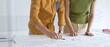 © rogerphoto - Business professionals analyzing financial reports, pointing at charts during collaborative meeting, discussing data with focused professional demeanor