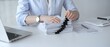 © volha_r - Business person working on financial documents, accounting or auditing a large stack of paperwork, managing tax forms and corporate reports with a pen at an office desk. Audit and taxes