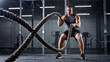 © Lumi Stock Studio - athletic man training with battle ropes in gym, muscular fitness model performing rope undulations, high intensity interval training workout in modern health club