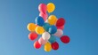 © Ze - Colorful balloons floating in a clear blue sky, creating a joyful and vibrant atmosphere.