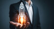 © TAHER - Future innovation a hand holding a glowing rocket blueprint