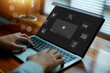 © wasan - Business professional using online video learning platform on laptop for digital education, remote training and multimedia courses. Modern interface for e-learning, skill development.
