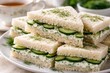 © AkuAku - English Tea Sandwiches with Cream Cheese and Cucumber on Plate