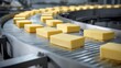 © vetrana - Cheese blocks moving on a conveyor belt in a factory during production process