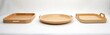 Three light wood trays sit on white background. One oval bowl dish and two rectangular serving platters with handles. Empty kitchenware for food presentation or serving.