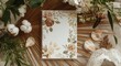 © TheWaterMeloonProjec - Cotton bloom adorned vertical handcrafted paper card on dried palm leaf creating romantic boho invitation scene