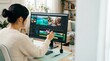 © Nexa - Young woman video editor working on travel footage in a bright home office using professional software