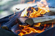 © Lena - Bright orange fire flames in a charcoal grill. Energetic heat and energy background for summer barbecue and kidult design.
