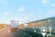 © fotofabrika - Logistics truck on highway with digital tracking graphics in motion at sunset