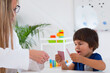 © Microgen - Child psychology, toddler doing logic tests with cards