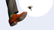 © master1305 - Tiny businessman falling after being kicked by giant shoe concept of rejection and instability. Concept of job loss, career risk, instability, sudden change and uncertainty in professional life.