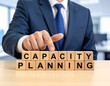 © magele-picture - Capacity planning - Geschäftsmann zeigt auf den Text 'Capacity planning'