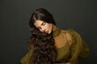 © millaf (Nemchinova) - Young woman hair. Beautiful model with long curly hairstyle posing