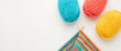 © SIMANG - Colorful yarn balls and a knitted piece in close-up view on white background