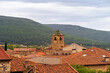 © Miguel Mar_Foto - Vinuesa village church tower with traditional spanish rooftops