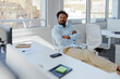 © BONNINSTUDIO/Stocksy - Man relaxing brainstorming creative ideas in modern office