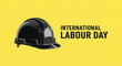 © Tuyul - International Labour Day greeting with hard hat on yellow background