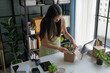 © Wanda - Asian Woman Packing Plants for Online Eco Business
