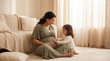 © AIMIN - Mother's Day pregnant woman with toddler daughter on floor touching belly expressing sibling curiosity love for lifestyle magazine editorial photography