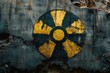 © Mariya - weathered yellow and black radiation hazard symbol painted on cracked concrete wall with peeling paint and rust, evoking a foreboding abandoned atmosphere