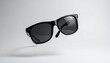 © Awan - Stylish sunglasses floating gracefully, embodying a sense of modern chic and summer relaxation. The sunglasses exude a timeless appeal and sophistication
