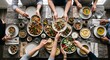 © Kyungho Woo - Top down view of hands sharing a beautifully arranged healthy meal on a rustic wooden table.