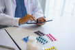 © Charlie's - Pharmacist using digital tablet and AI system for medication management using technology and AI innovation healthcare and smart pharmacy.