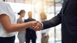 © Christine - Professional business handshake between two colleagues, symbolizing successful partnership and agreement in a modern.
