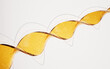 © Vink Fan - Transparent golden DNA structure with details, 3d rendering.