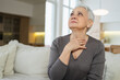 © Юлия Завалишина - Sad tired ill sick lonely disappointed older senior woman sitting at home alone. Unhappy mature grandmother experiencing grief relative death bad news. Stressed elder lady suffering from loneliness
