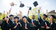 © Ahmed - Diverse university graduates tossing caps in celebration outdoors