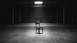 © bejopayon - Single chair in dark empty room.