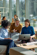 © bernardbodo - Diverse business team collaborating on marketing strategies