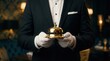 © Sukon - Concept of the service industry featuring a butler with a gold service bell.