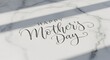 © Sabbir - Elegant mother's day calligraphy on a textured white surface