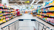 © Bonsales - Shopping cart moving through supermarket aisle with colorful retail products, modern grocery store consumer journey concept