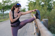 © FotoAndalucia - Woman Stretching and Warming Up Before Running